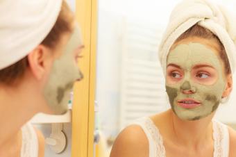 Woman wearing green mud mask