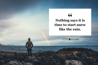 Woman watching rainbow over Icelandic landscape