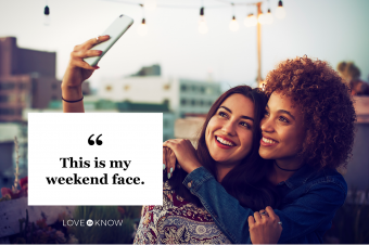 Friends taking a selfie on urban rooftop
