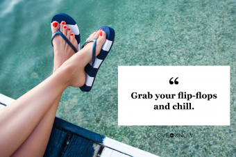 Woman feet with blue flip flops on the pier