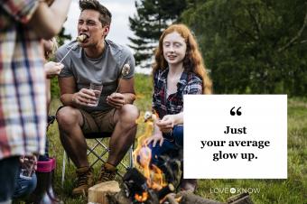 father and children eating marshmallows around campfire