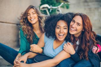Group of beautiful young women laughing outdoors