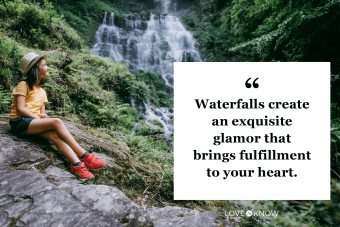 Young girl in forest with waterfall