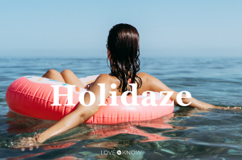 Young woman in a sprinkled doughnut float at the beach