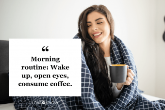 Beautiful young woman drinking coffee in bed at the morning