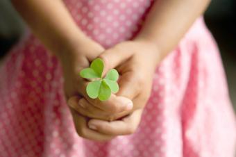 Little girl with clover leaf