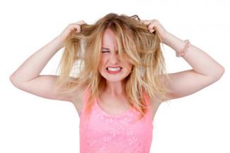 Frustrated woman pulling her own hair