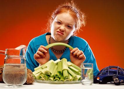 Woman with plate of celery