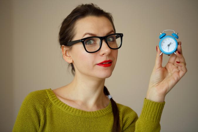 Woman with alarm clock