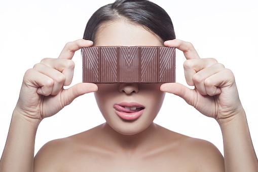 Woman holding chocolate bar