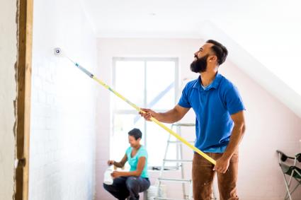 Couple painting their home