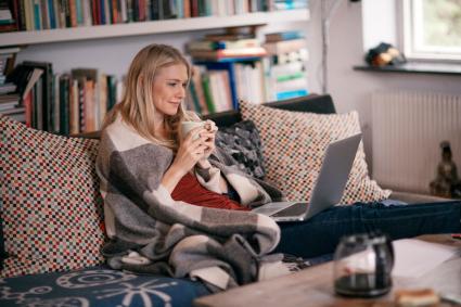 Woman watching a movie in a laptop