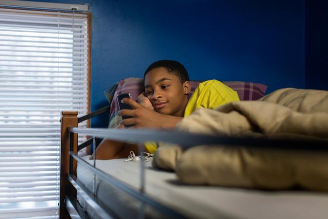 boy in loft bed