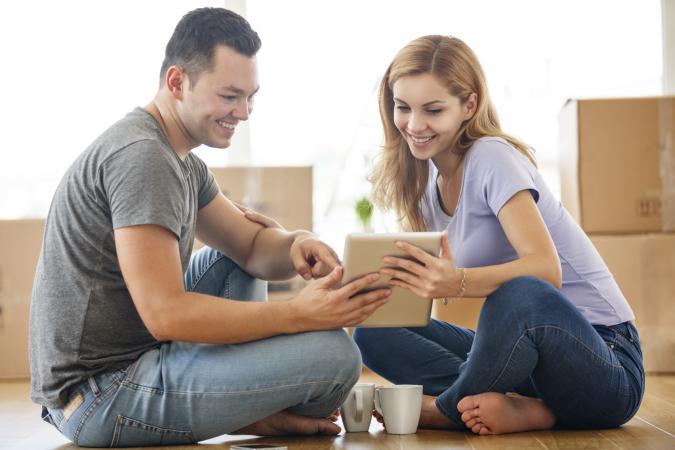 Young couple in new home shopping for furniture