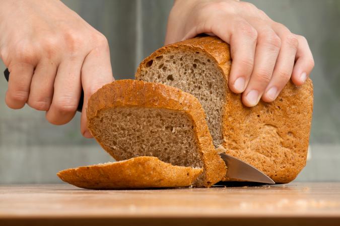 Cutting a loaf of bread