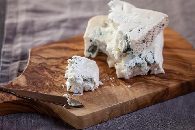 Gorgonzola cheese on chopping board