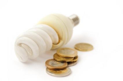compact fluorescent light bulb and coins