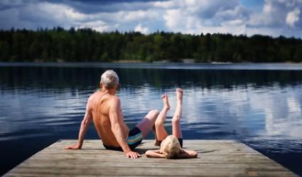 grandfather and grandson at lake