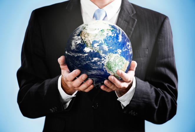 businessman holding Earth