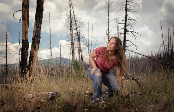 Woman in a Burnt Forest
