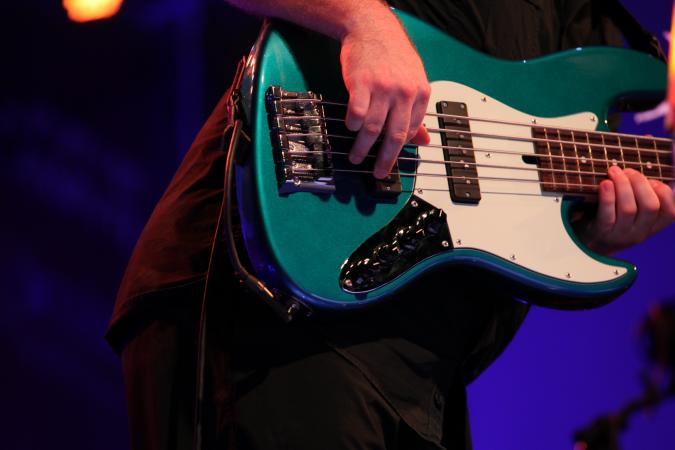 Man Playing Bass Guitar