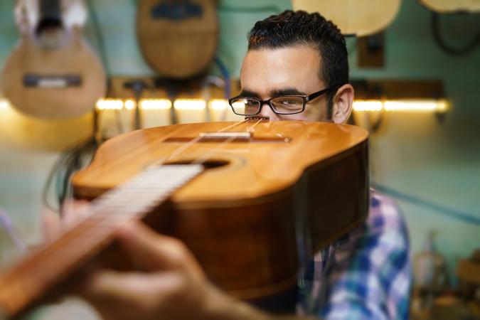 appraising acoustic guitar