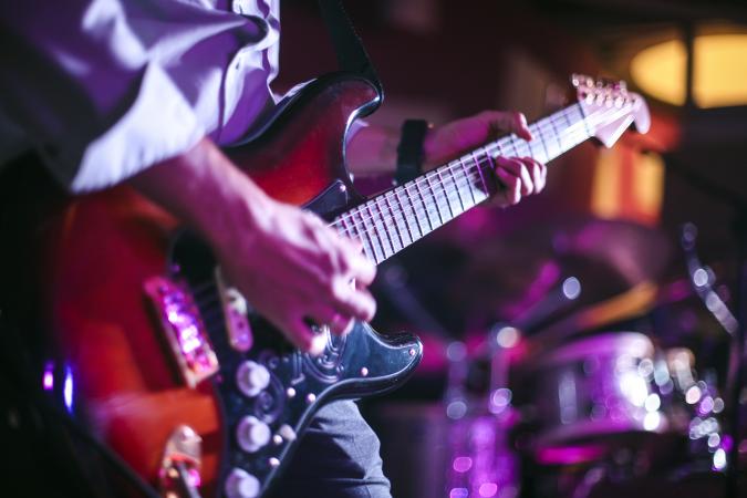 guitarist playing in a concert
