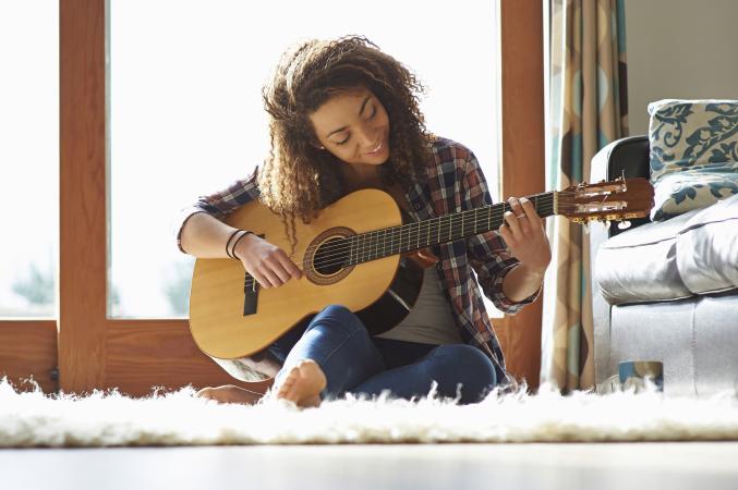 Woman playing guitar