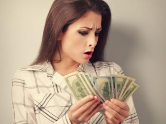 Woman looking at money