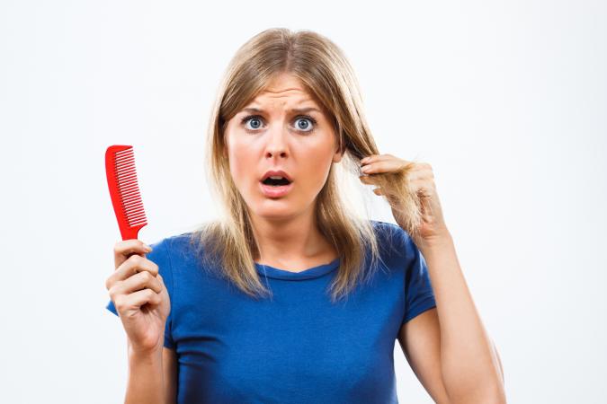 woman losing her hair