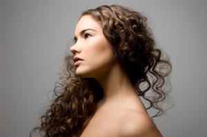 Brunette woman with curly hair extensions