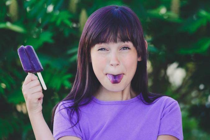 Girl with purple hair and a purple shirt