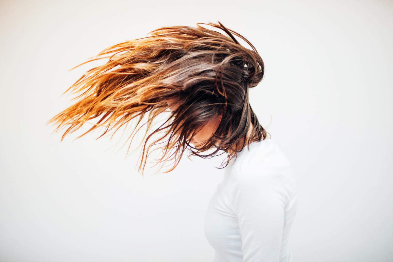Portrait of girl tossing her hair