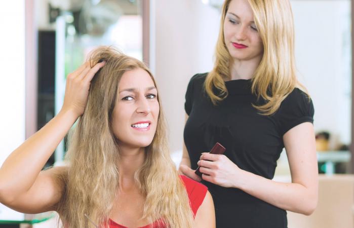 Woman at the hairdresser getting advise
