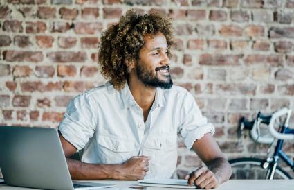 Smiling young man at desk 