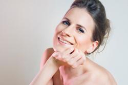 Image of a woman with a cute messy updo