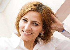Woman with a short, layered haircut