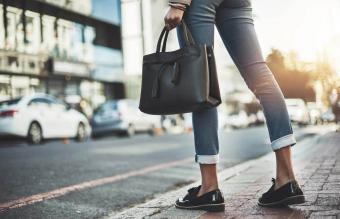 businesswoman walking with her handbag