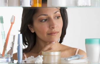 woman in front of a bathroom cabinet 