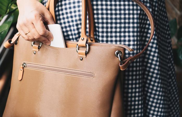 Woman with brown leather purse