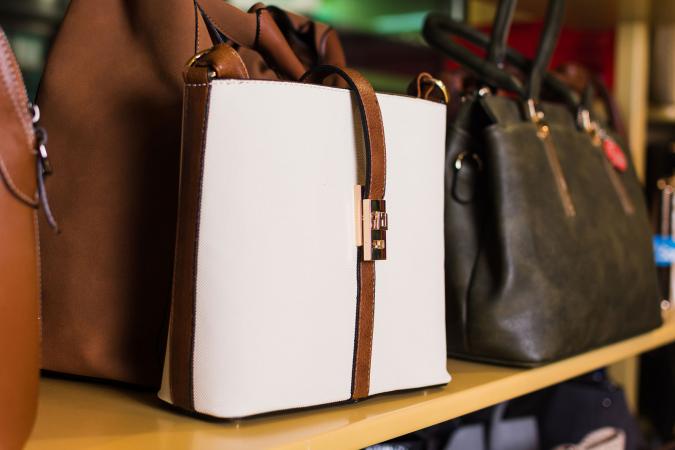 Leather handbags on shelf