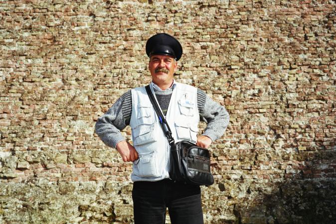 bus conductor with crossbody purse