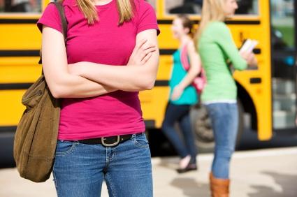 School girl with backpack purse