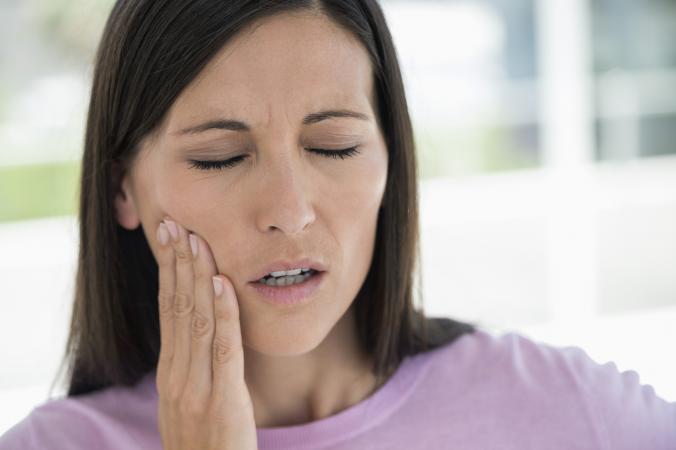 Woman suffering from a toothache