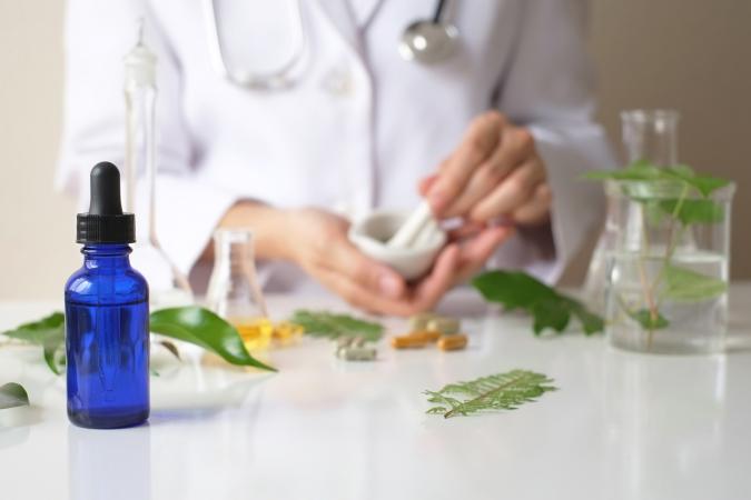 person mixing herbal remedy