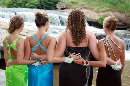 Four friends in prom dresses