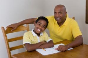 father homeschooling child