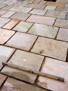 Flagstone patio being built.
