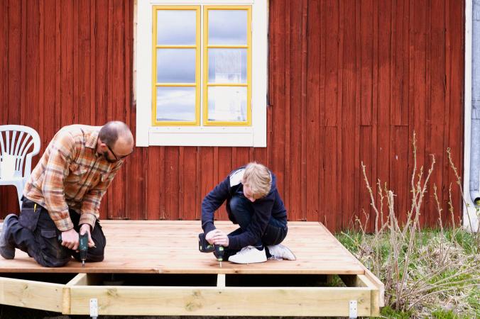 Father and son building a deck