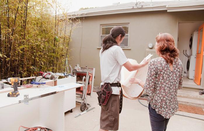 Woman talking with home contractor